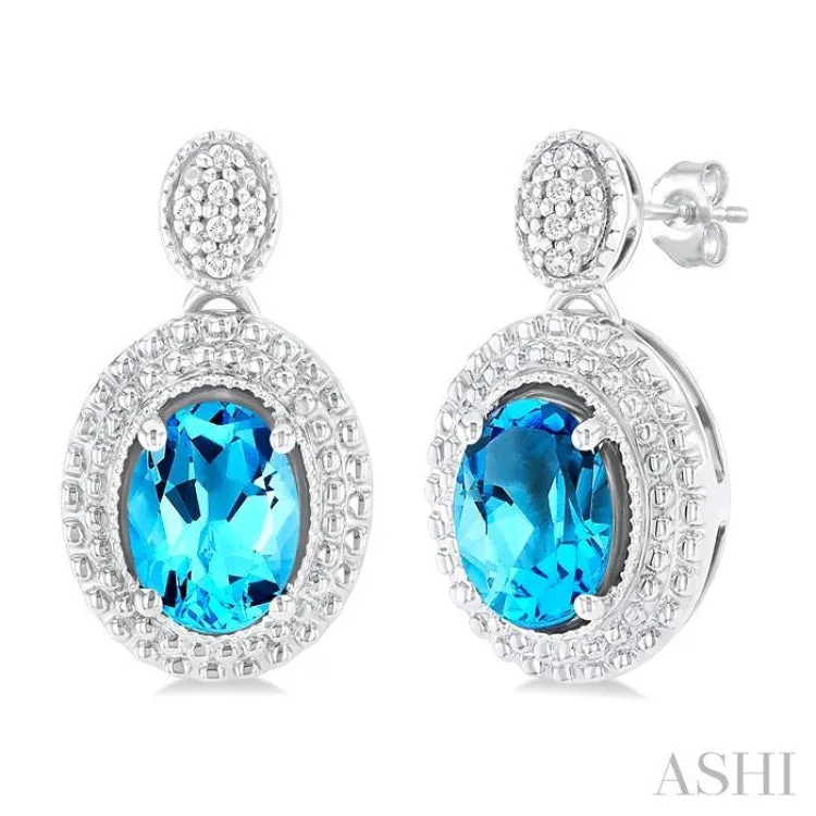 1/20 ctw Oval Cut 7X5 MM Blue Topaz and Round Cut Diamond Semi Precious Earring in Sterling Silver