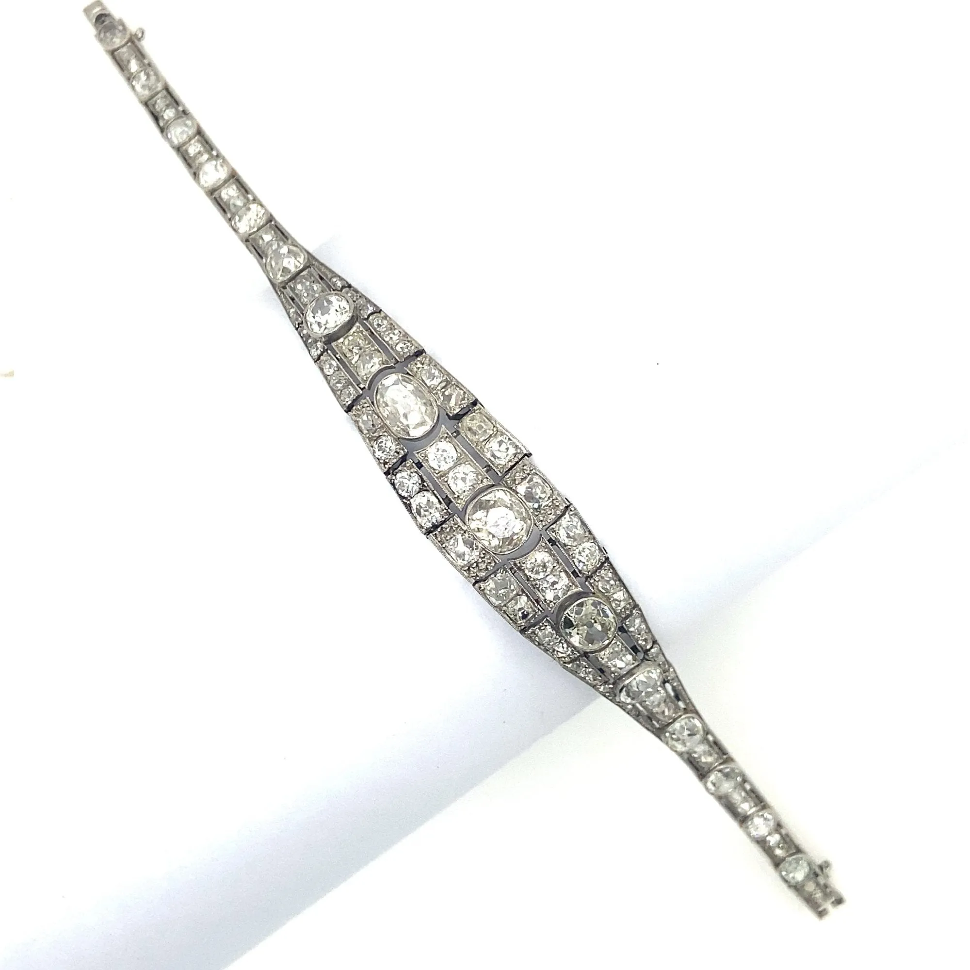 An Art Déco platinum, brilliant-cut and cushion-cut diamond bracelet. France, 1930.