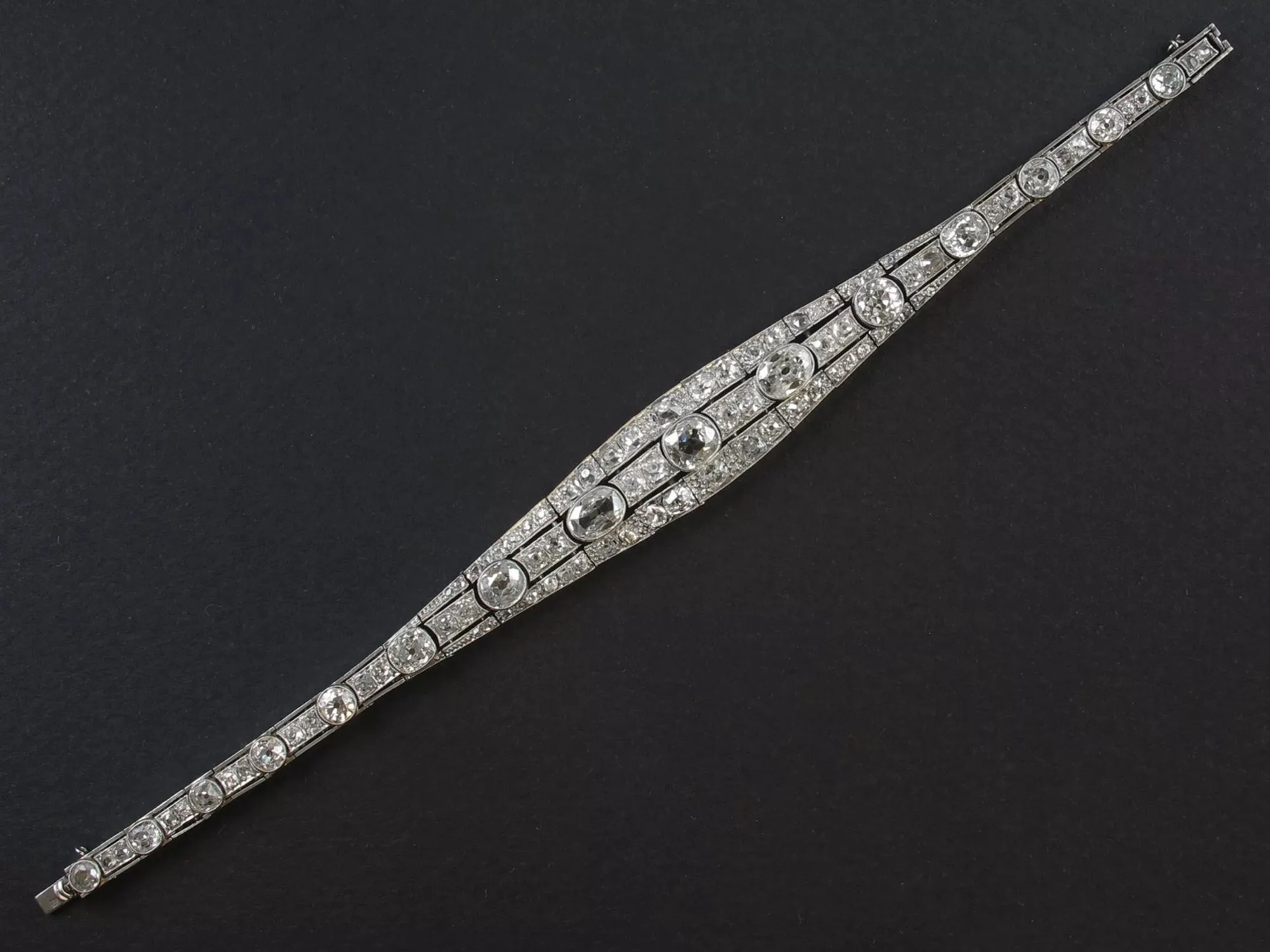 An Art Déco platinum, brilliant-cut and cushion-cut diamond bracelet. France, 1930.