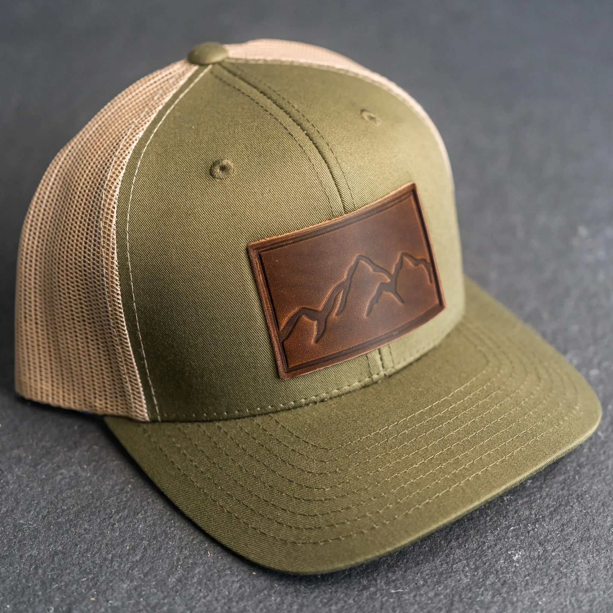 Leather Patch Trucker Style Hat - Mountain Range Stamp