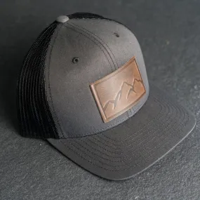 Leather Patch Trucker Style Hat - Mountain Range Stamp