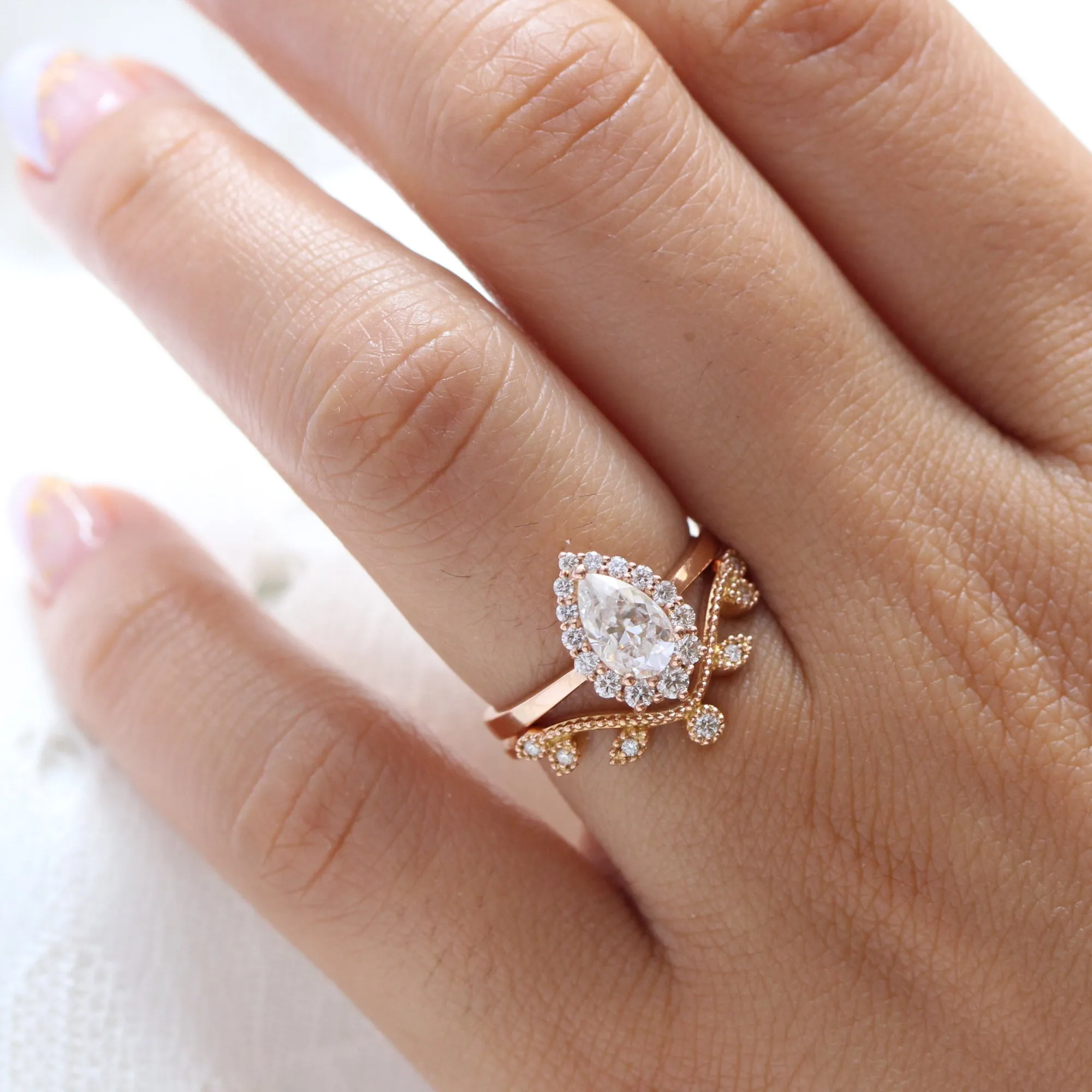 Pear Moissanite Engagement Ring in Tiara Halo Diamond Tapered Band