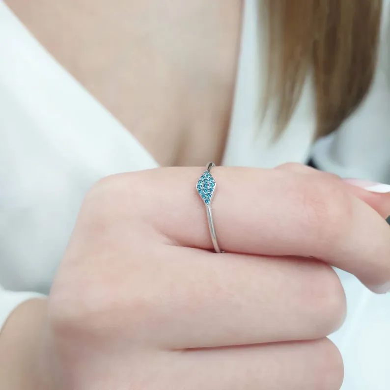 Triangle ring with blue diamonds