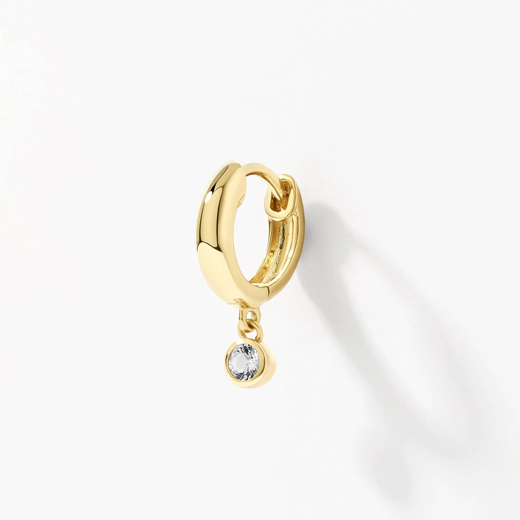 White Topaz Round Drop Charm Huggies in Gold